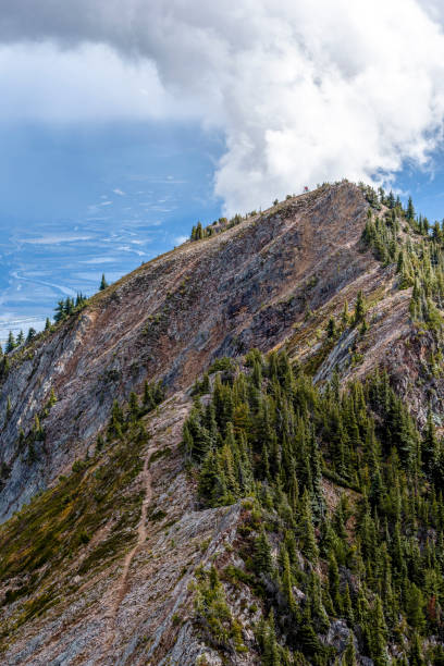 istock View of mountain biker descending mountain ridge 1332556403