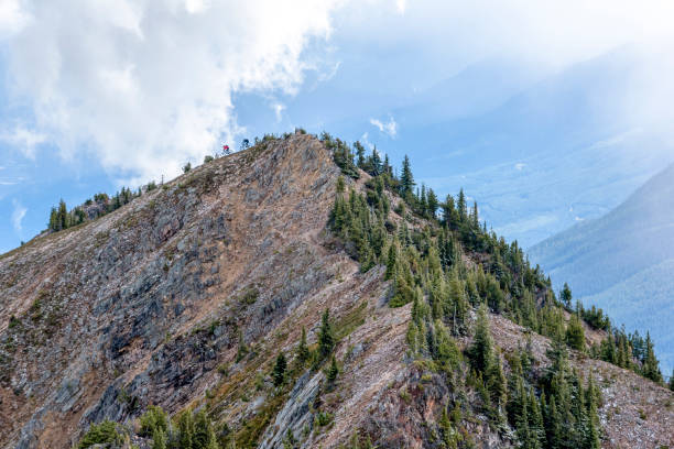 istock View of mountain bikers descending mountain ridge 1332556449