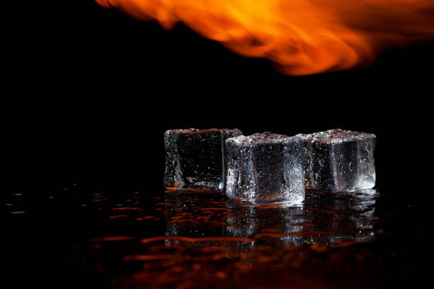 istock fire and ice, ice cubes and flames, black background 1332558026