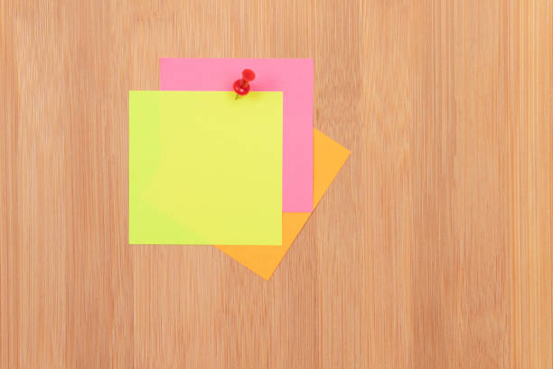 istock Colored Sticky Notes Pinned to the Wooden Message Board 1332564577