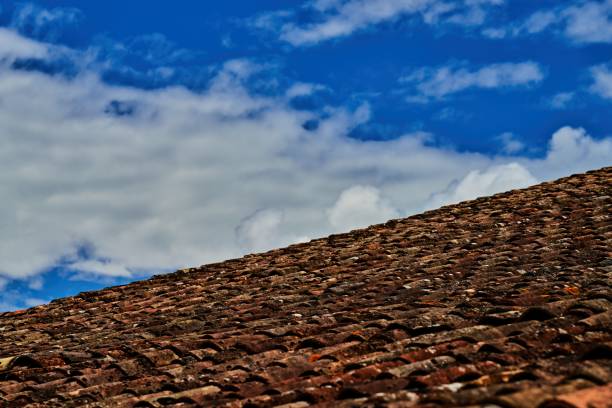 istock brown roof tiles against a blue sky 1332564581