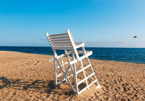 istock One small white lifeguard stand on a beach 1332566583