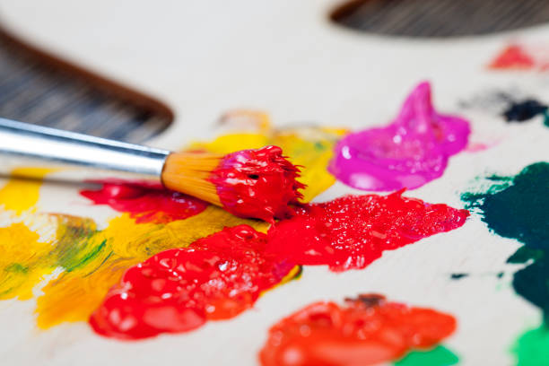 istock mixed on a wooden palette of multi-colored paints 1332566646