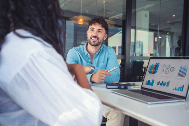 business colleagues having a conversation - financial occupation business people success imagens e fotografias de stock