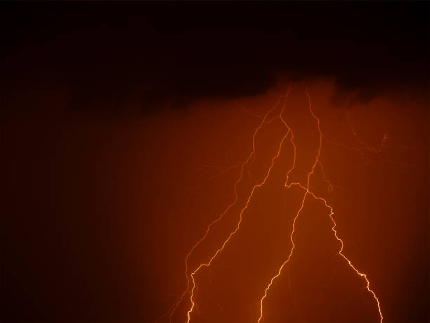istock There are many lightning bolts against the black sky. 1332572821