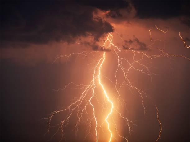 istock There are many lightning bolts against the black sky. 1332572829