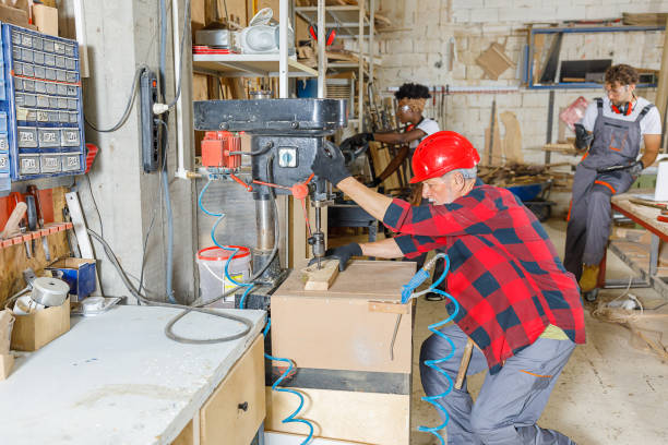 istock A Small Group of Carpenters of Different Ethnicities are Working in Workshop. 1332575379