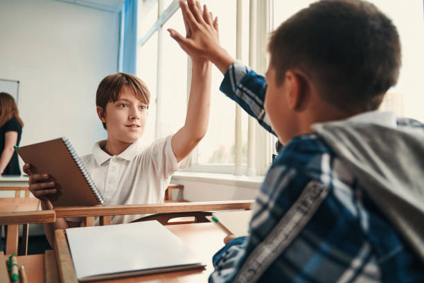 istock Teamwork at the lesson teaching children to cooperate 1332576685