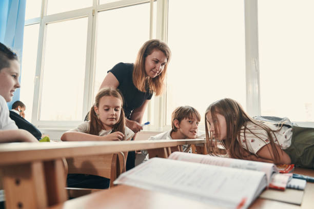 istock Confident teacher waiting for the answer from her pupils 1332576749