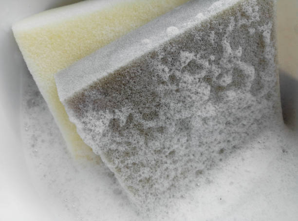 istock yellow and gray sponge with white froth stain bubbles 1332578612