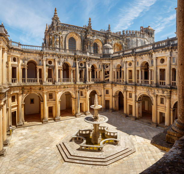 View, from the top floor, of the main cloister of the Convento de Cristo in Tomar, Portugal, on a sunny day. stock photo