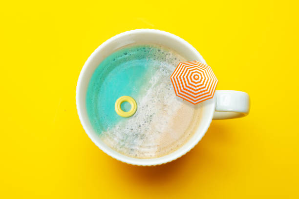 istock Beach in the coffee cup with inflatable doughnut 1332585751