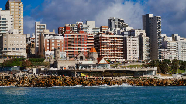 Mar del Plata, Argentina- July 26, 2021: Panoramic view of Mar del plata city, buildings and beach taken from the ocean on a sunny winter morning under a blue sky with a few clouds