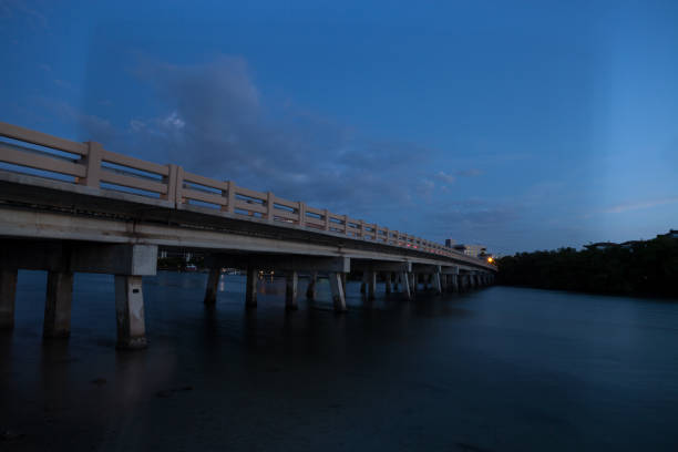 istock Night sky over bridge over Hickory Pass leading to the ocean 1332588466