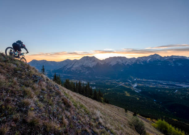 istock View of mountain biker descending mountain ridge 1332588519