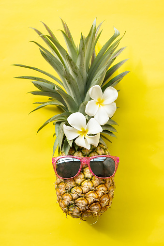 pineapple hipster in sunglasses, fashion. stylish fruit. minimal concept, summer tropical pineapple. creative art fashionable vacation concept. summertime color mood, pineapple fruit.