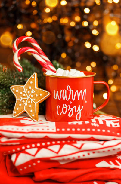 istock Hot coffee or cocoa with candy canes and marshmallows. Decorations 1332598576
