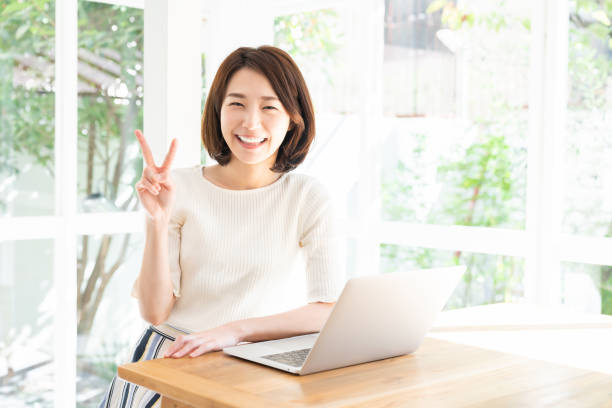 istock young asian woman using laptop 1332598832