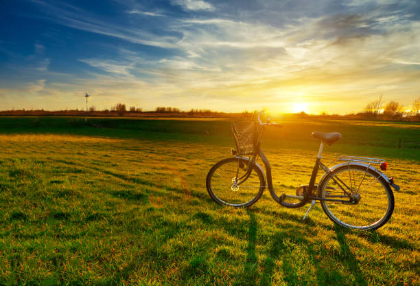 istock beautiful landscape image with Bicycle at sunset 1332611659