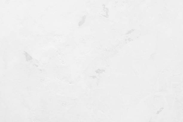 istock White concrete stone surface paint wall background, Grunge cement paint texture backdrop, White rough concrete stone wall background, Copy space for interior design background, banner, wallpaper 1332612581