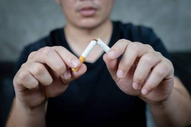 istock Men quit smoking to maintain health 1332613593