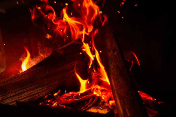 istock Fireplace with burning wood, closeup view. Winter vacation 1332616232