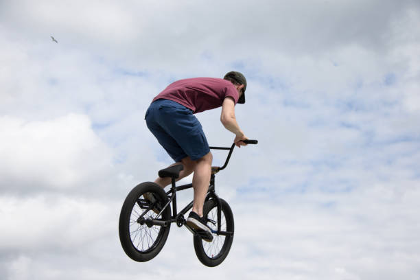 istock Extreme cycling.A man is riding a bicycle against the sky 1332617659