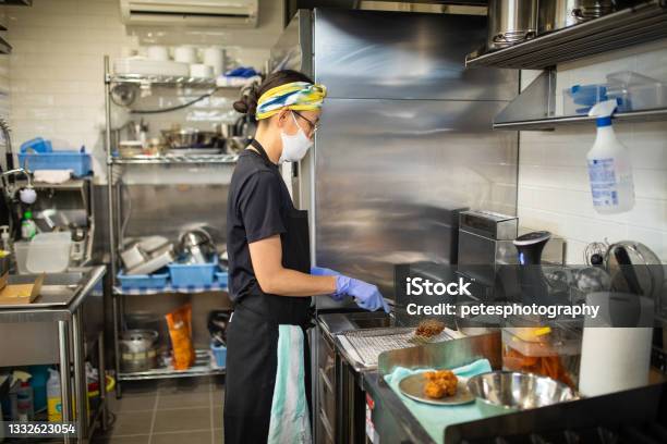 Female Chef Preparing Food In Her Cafe Kitchen Stock Photo - Download Image Now - Commercial Kitchen, Japanese Ethnicity, 40-44 Years
