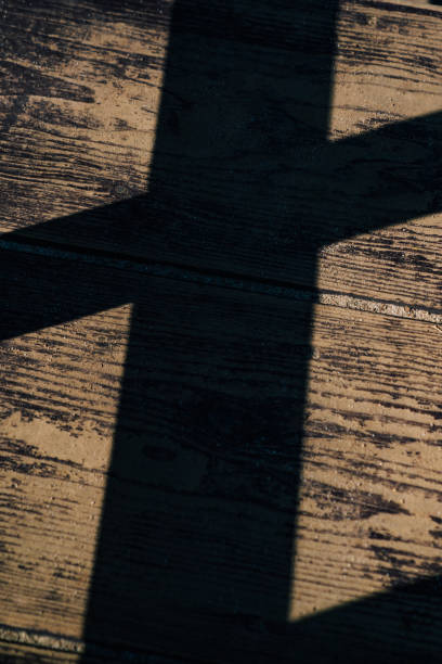 istock An old tree trail and a wooden cross. 1332625523