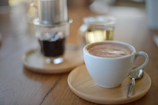 istock Hot Chocolate mugs on rustic wooden table 1332629342