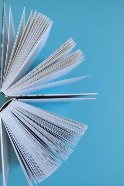 istock Book close-up on a blue background.Reading and education concept. Knowledge and Learning. Reading of books. Knowledge and education. 1332632355