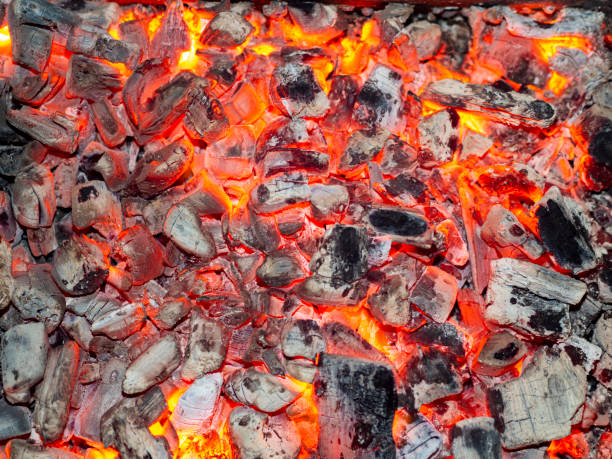 istock Detailed texture of burning charcoal in a campfire. 1332633960