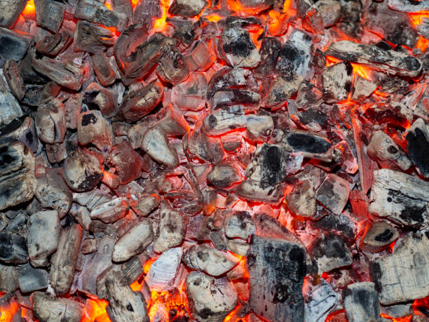 istock Detailed texture of burning charcoal in a campfire. 1332633967