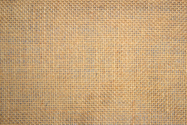 istock Jute hessian sackcloth canvas woven texture pattern background in light beige cream brown color blank empty 1332635001