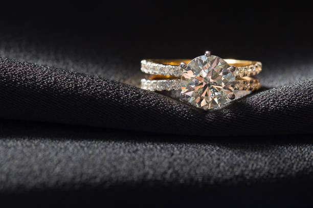 istock Jewellery ring against black fabric background 1332636340