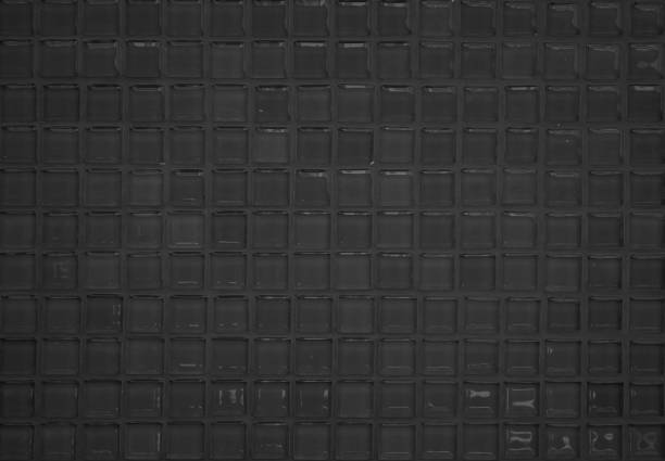 istock Black tile wall high resolution real photo or brick seamless  pattern and texture interior room background. Dark grid tiles wall texture for the decoration of the bedroom, Home or office backdrop. 1332637758