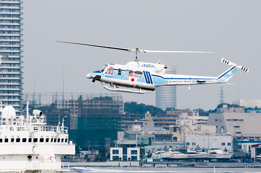Yokohama, Japan - September 19, 2011: A helicopter of the Japan Coast Guard is in flight in Yokohama, Japan.