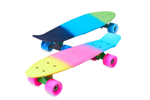 istock Two rainbow plastic Penny board skateboards on white background 1332638880