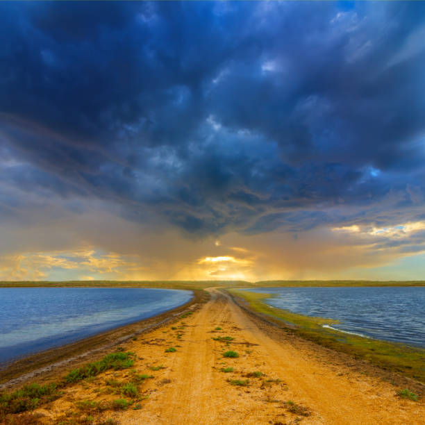 small lakes in prairie at the dramatic sunset, evening natural scene