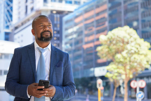 istock Serious businessman on his phone 1332640517