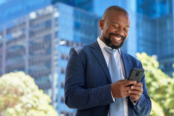istock Handsome businessman using his phone 1332640923