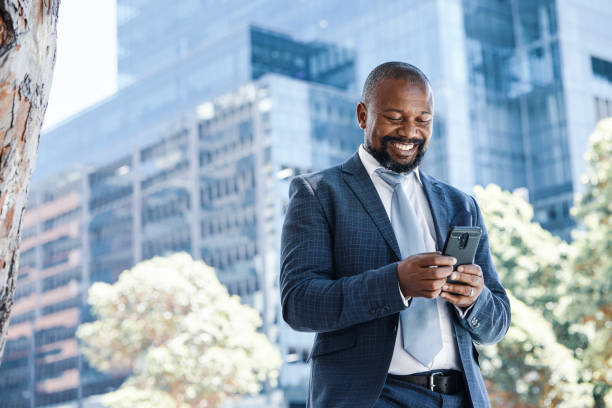 istock Handsome businessman using his phone 1332641740