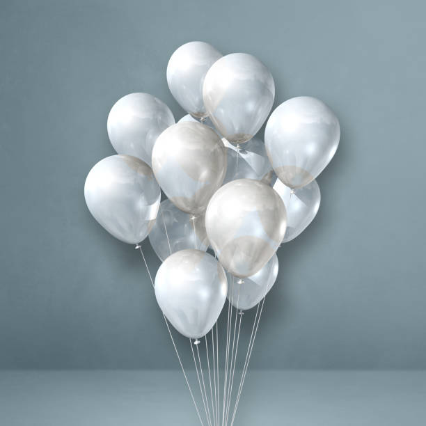istock White balloons bunch on a grey wall background 1332643992
