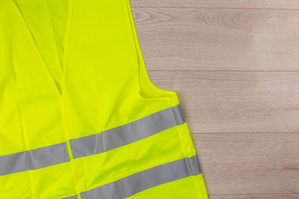 Protective vest on the wooden background