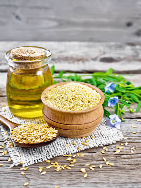 istock Bran flaxseed in bowl with oil in jar on board 1332644952