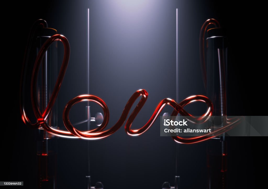 Love Chemistry Experiment A concept of a glass chemistry set with the word love spelt out in red liquid in the pipes between two spotlit pipettes on an isolated dark background - 3D render Brightly Lit Stock Photo