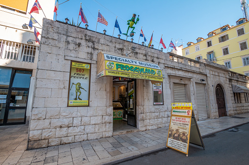 Froggyland Museum on Ulica kralja Tomislava (King Tomislav Street) in Split, Croatia. This is a quirky exhibition with stuffed frogs displayed in human activities such as sport and sitting in class.