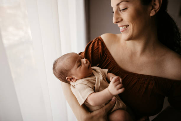 istock Mother holding her newborn son 1332653045