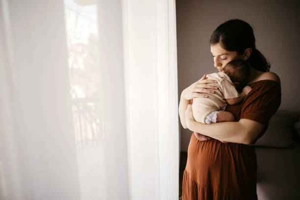 istock Mother holding her newborn son 1332653323