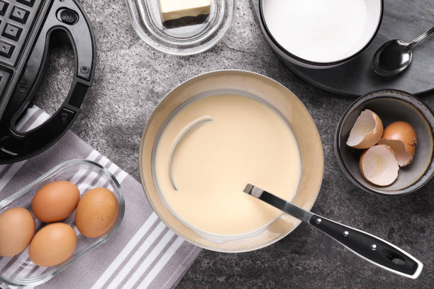 istock Flat lay composition with ingredients for cooking Belgian waffles on grey table 1332654427